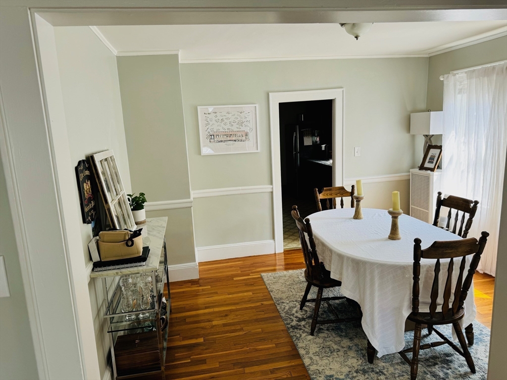 43 Chapman Street, Unit 2 Watertown, MA 02472 - Photo 3 of 12 a dining room with furniture and wooden floor