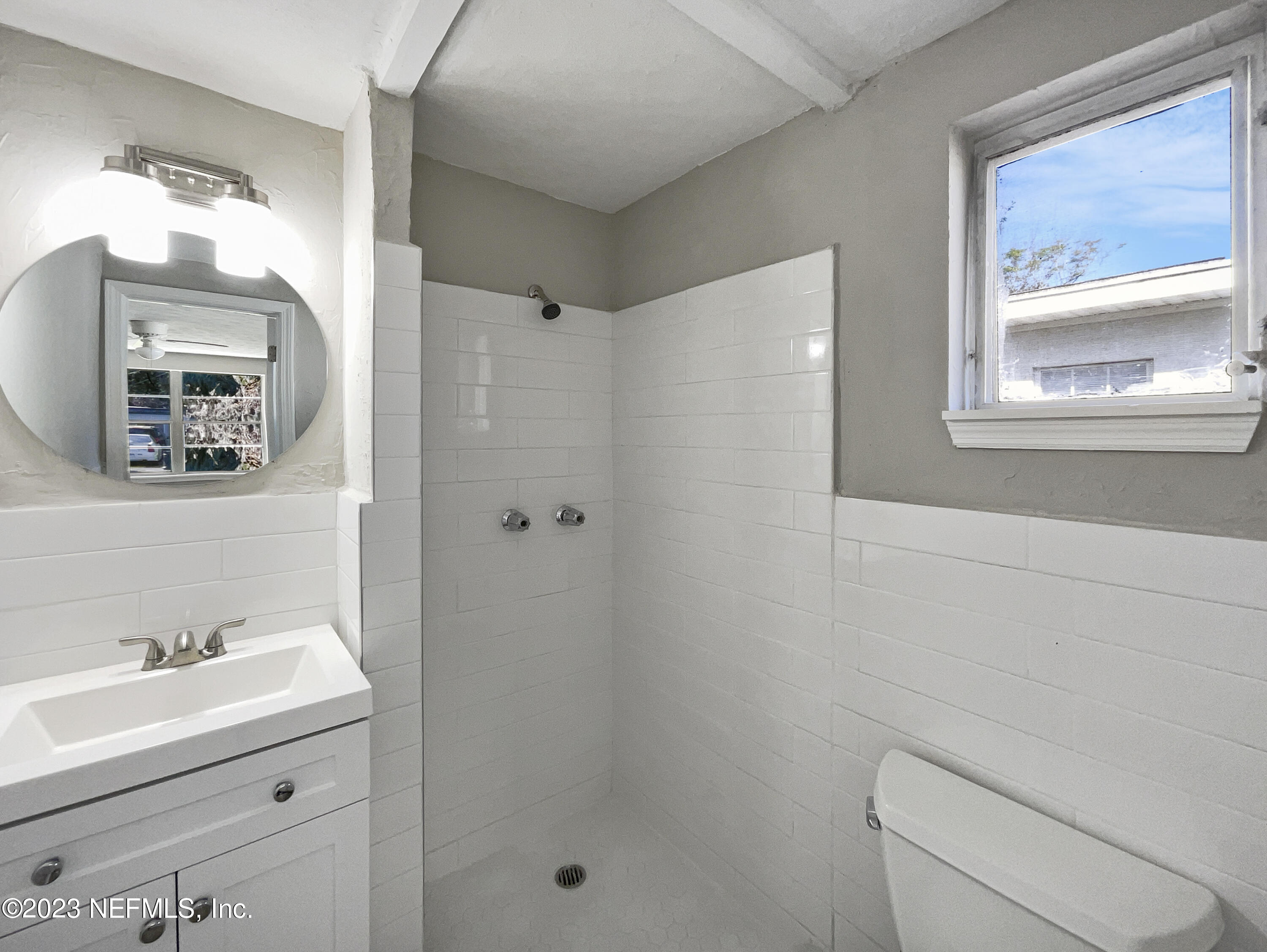 5624 Orangewood Road Jacksonville, FL 32207 - Photo 16 of 19 a bathroom with a sink a toilet and shower