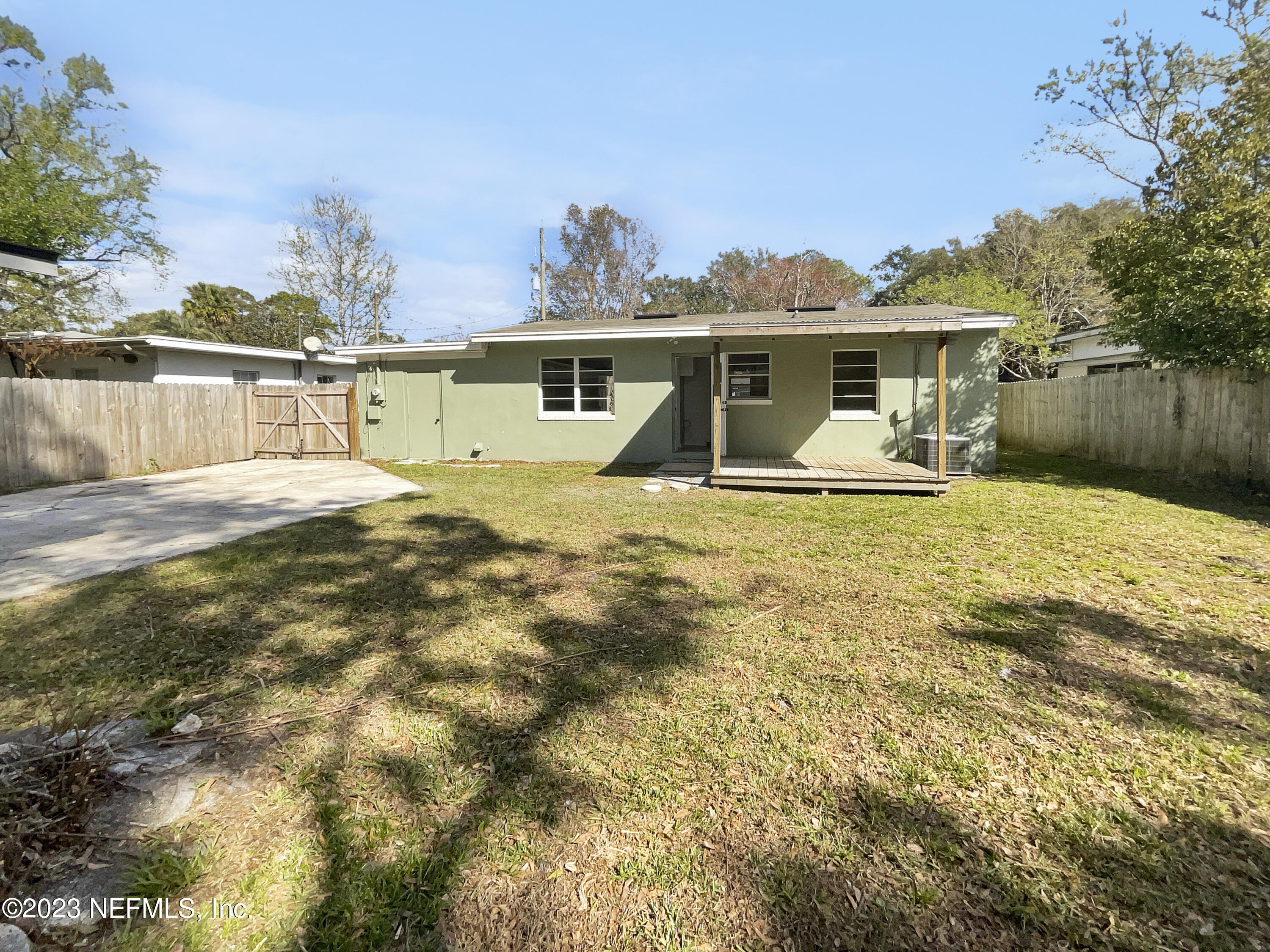5624 Orangewood Road Jacksonville, FL 32207 - Photo 18 of 19 a front view of house with yard and trees in the background