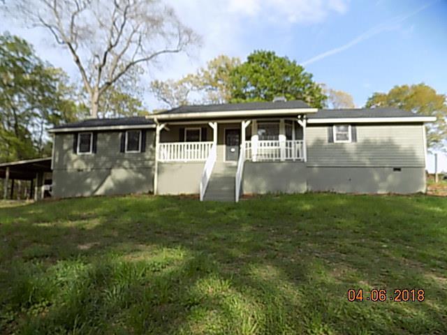 6340 Britt Road Macon, GA 31216 - Photo 1 of 21 a view of a backyard with plants and large trees