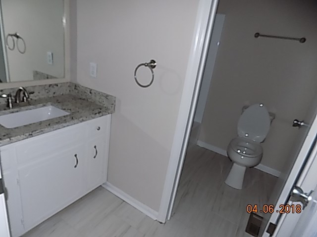 6340 Britt Road Macon, GA 31216 - Photo 12 of 21 a bathroom with a granite countertop sink