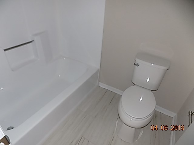6340 Britt Road Macon, GA 31216 - Photo 13 of 21 a bathroom with a toilet and a rug