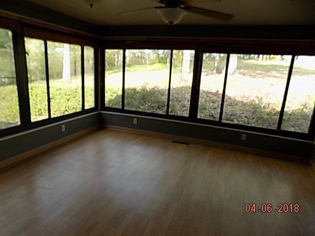 6340 Britt Road Macon, GA 31216 - Photo 10 of 21 a view of room with floor to ceiling windows
