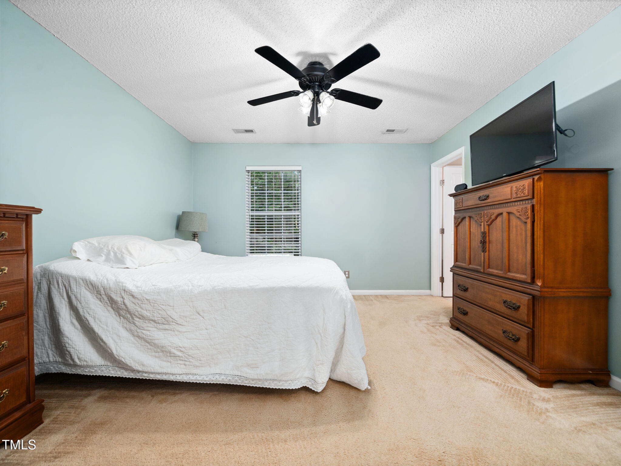 209 Climbing Ivy Court Cary, NC 27511 - Photo 14 of 24 a bedroom with a bed and window