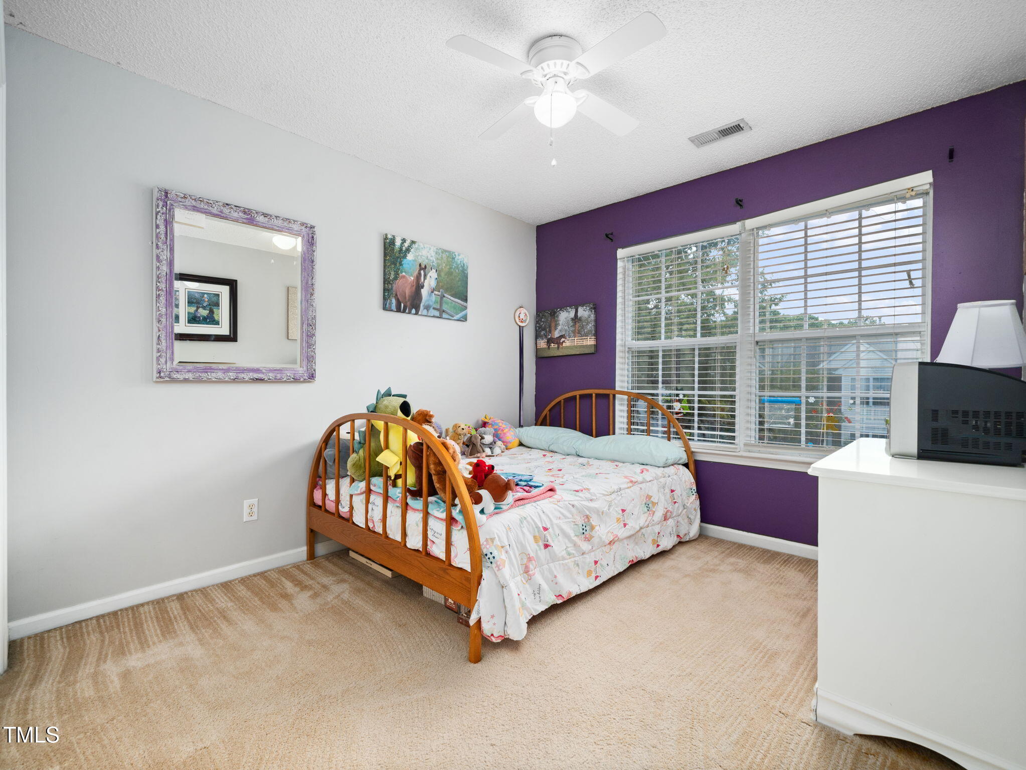 209 Climbing Ivy Court Cary, NC 27511 - Photo 16 of 24 a bed room with a bed and a window