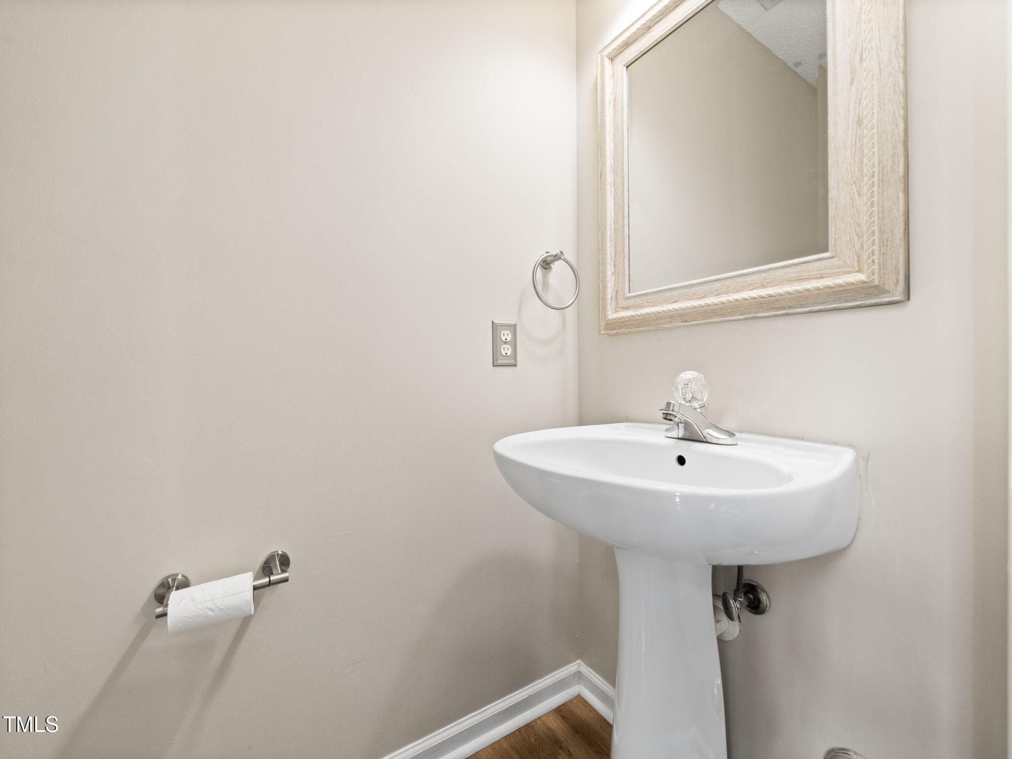 209 Climbing Ivy Court Cary, NC 27511 - Photo 19 of 24 a bathroom with a sink a mirror and a toilet