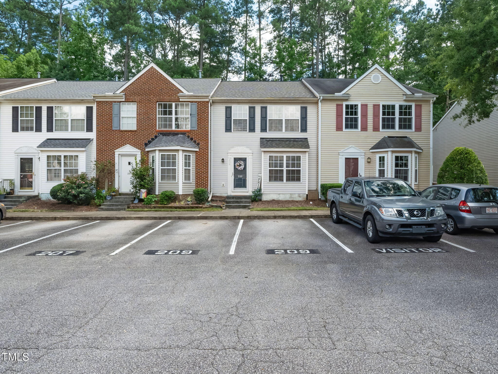209 Climbing Ivy Court Cary, NC 27511 - Photo 24 of 24 a front view of a house with cars parked