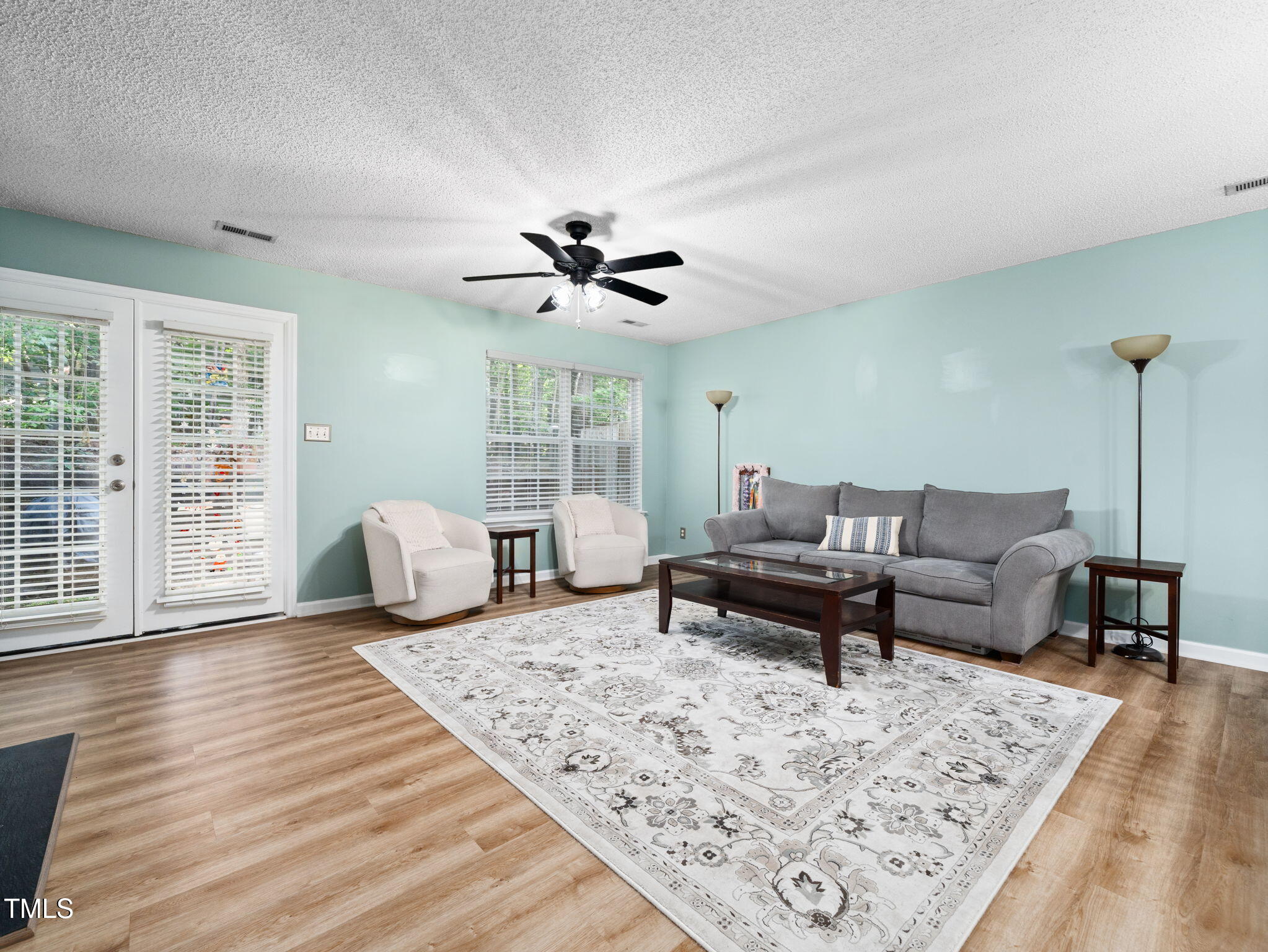 209 Climbing Ivy Court Cary, NC 27511 - Photo 3 of 24 a living room with furniture and a wooden floor