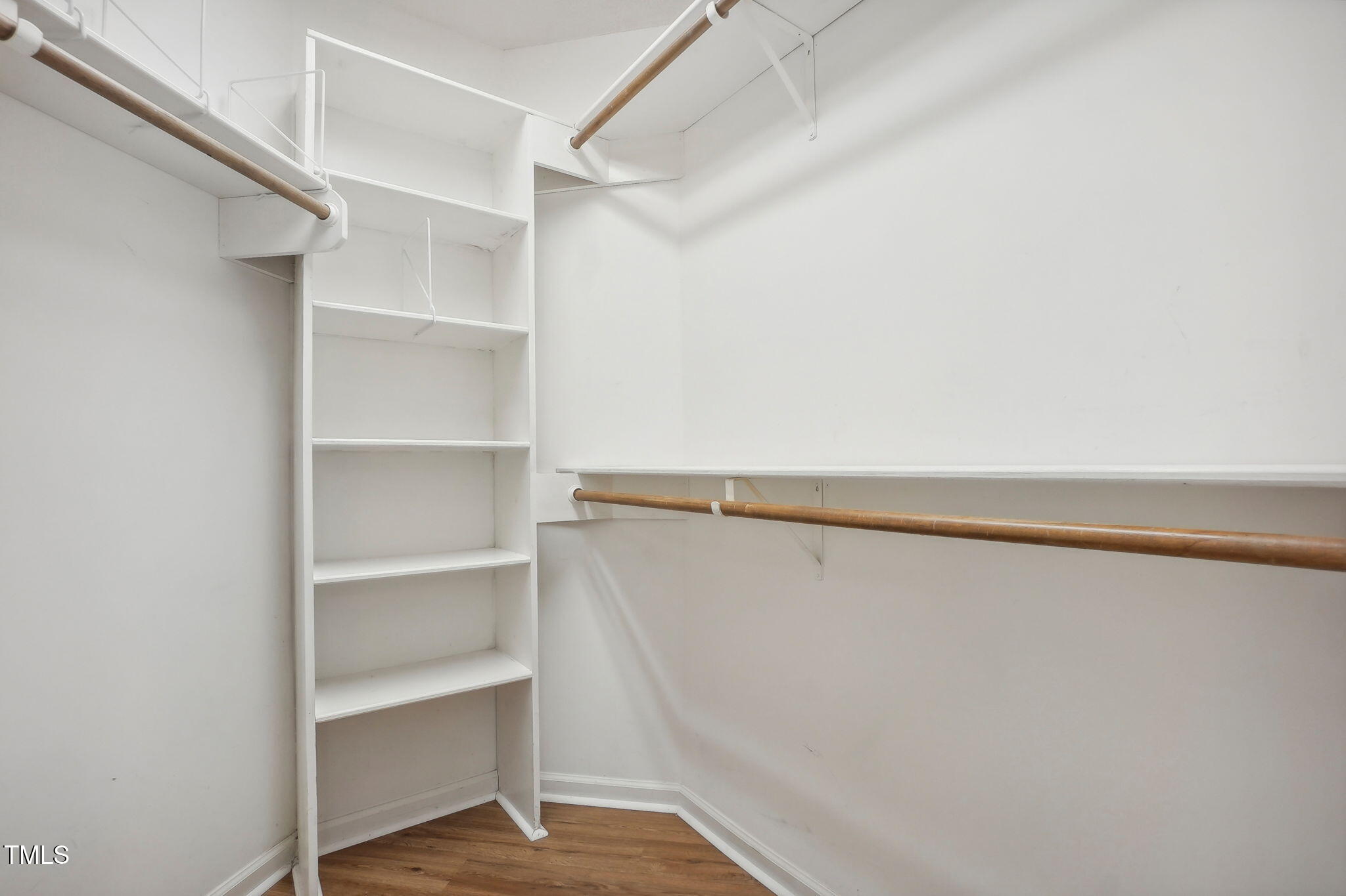 31 Renwick Court Raleigh, NC 27615 - Photo 21 of 32 a view of walk in closet with empty racks