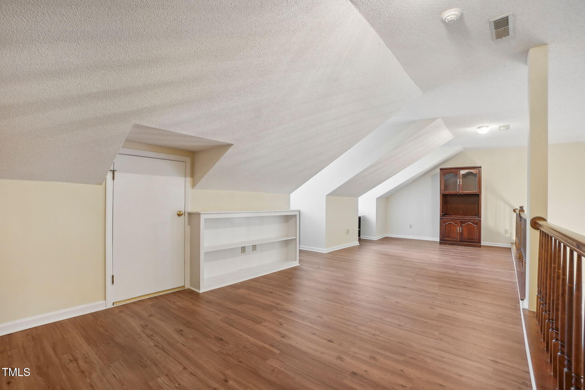 31 Renwick Court Raleigh, NC 27615 - Photo 25 of 32 a view of empty room with wooden floor and window