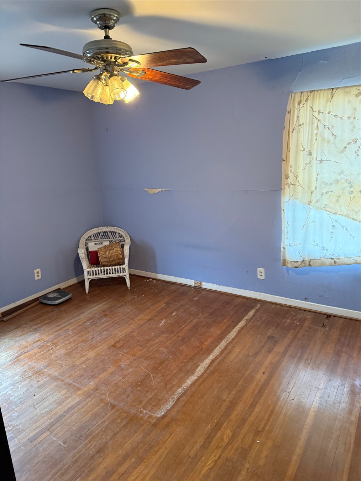 10906 Stover Street Houston, TX 77075 - Photo 11 of 19 a view of a room with wooden floor and window