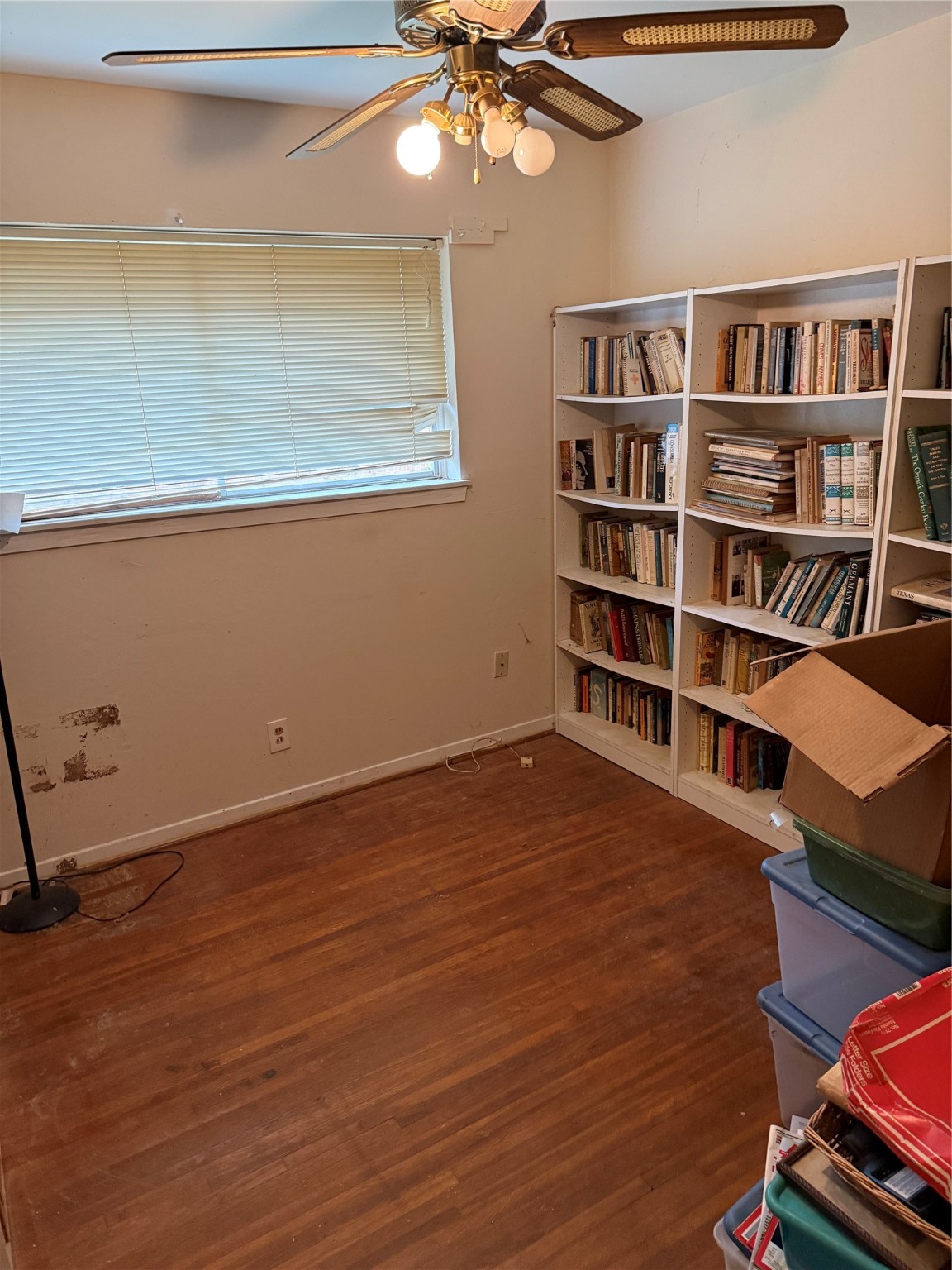 10906 Stover Street Houston, TX 77075 - Photo 14 of 19 a view of room with window and wooden floor