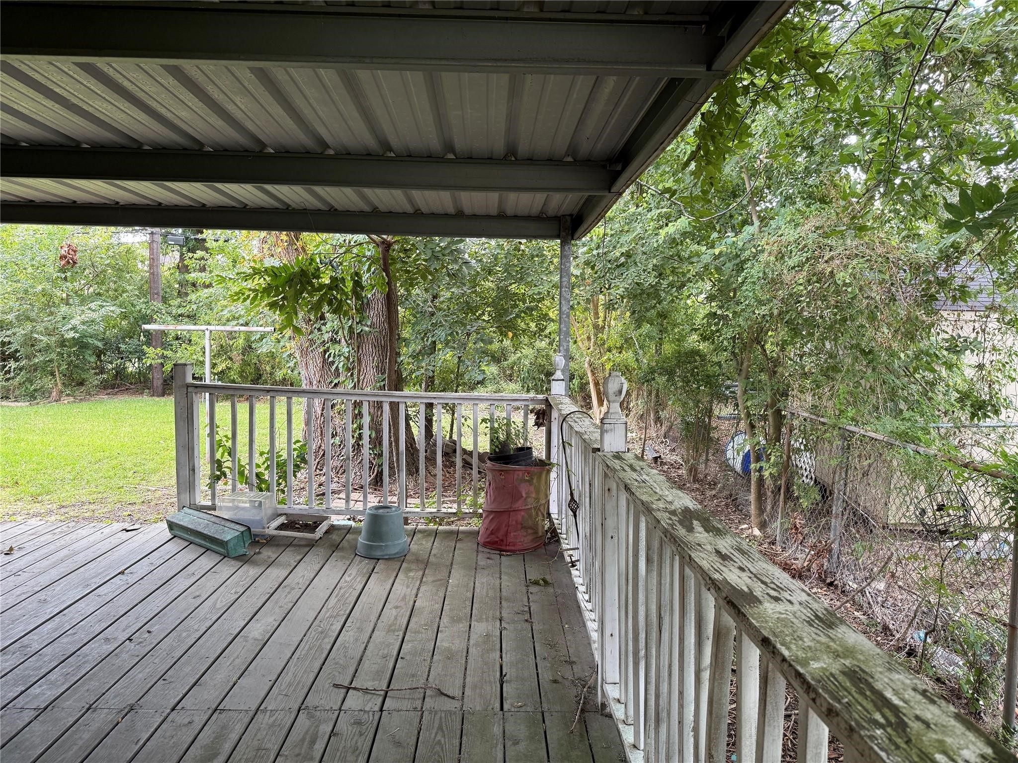 10906 Stover Street Houston, TX 77075 - Photo 17 of 19 a view of a balcony with wooden floor and outdoor space