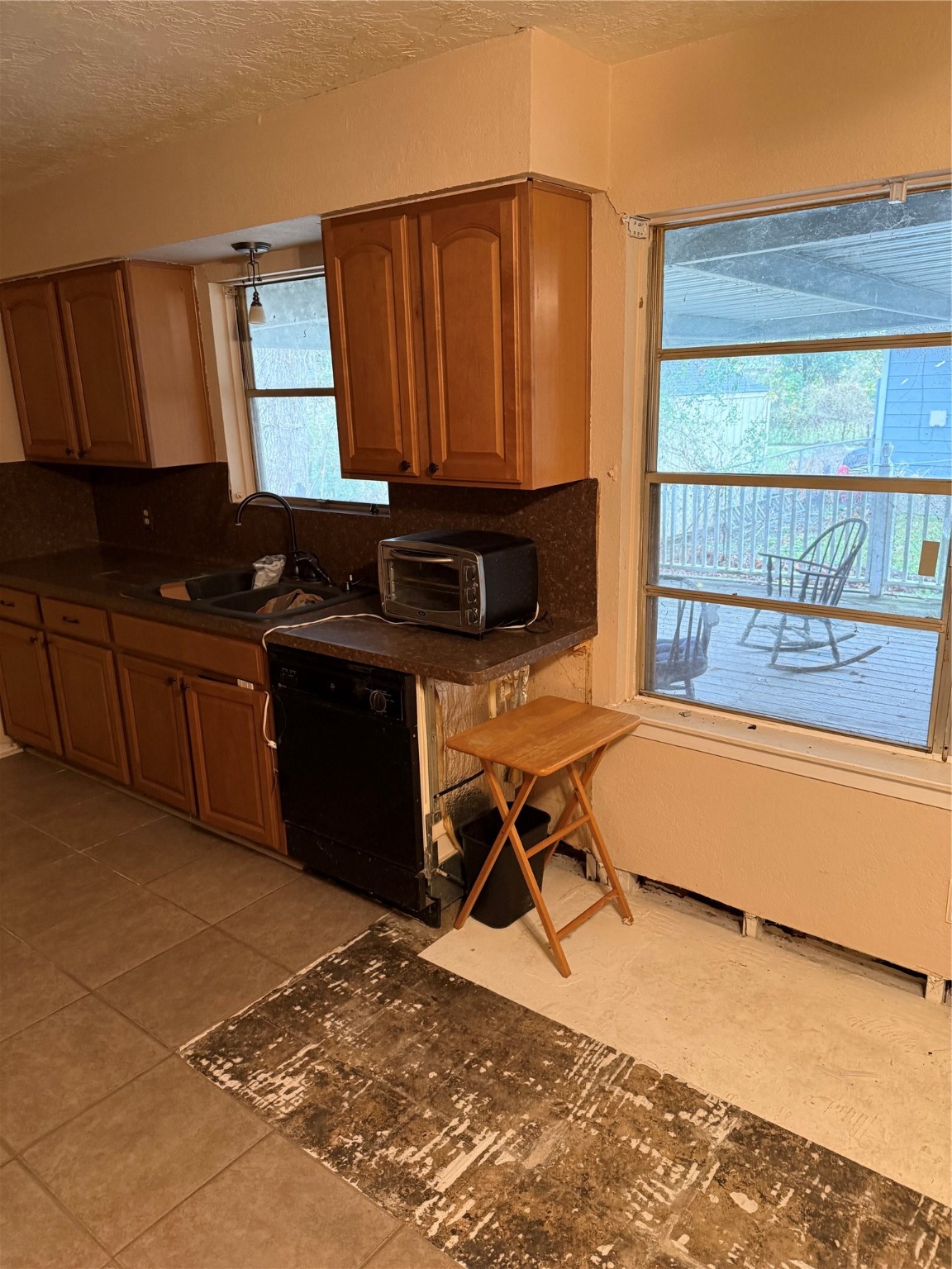 10906 Stover Street Houston, TX 77075 - Photo 8 of 19 a kitchen with a sink cabinets and wooden floor
