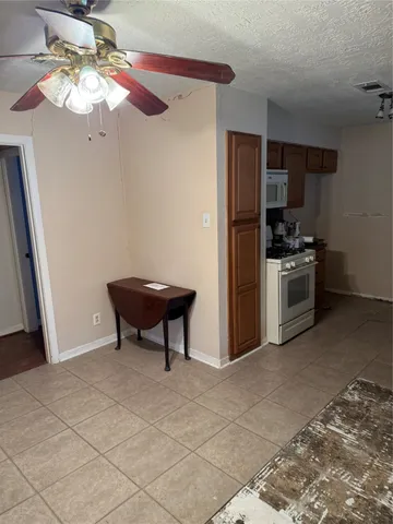 a view of a room with wooden floor and window