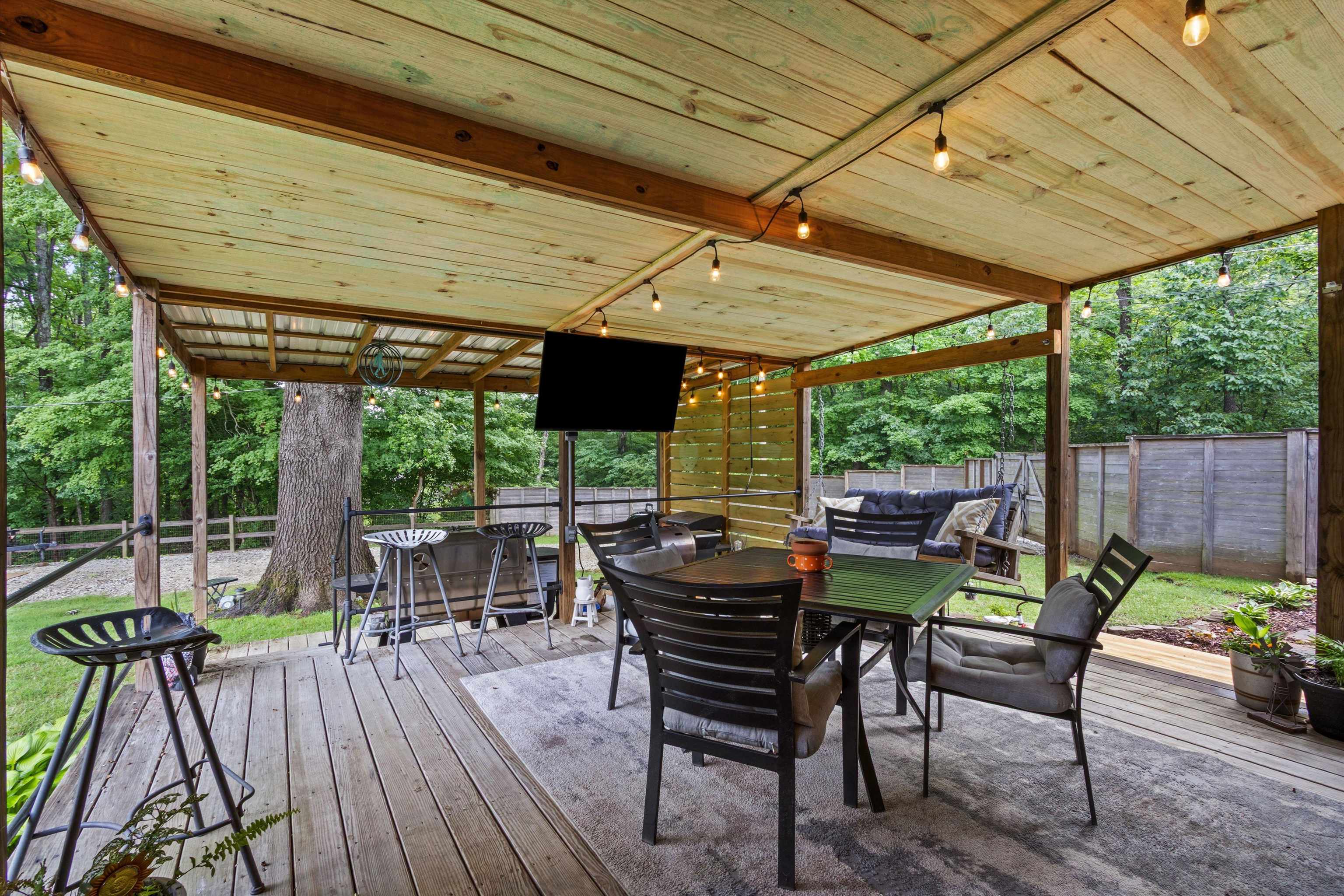 4500 Drummonds Road Drummonds, TN 38023 - Photo 19 of 29 a view of patio with table and chairs and floor to ceiling window