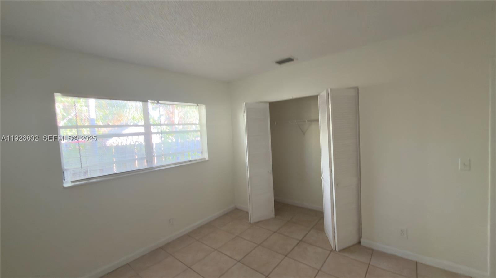 274 Southwest 9th Street, Unit 2 Dania Beach, FL 33004 - Photo 20 of 24 an empty room with windows