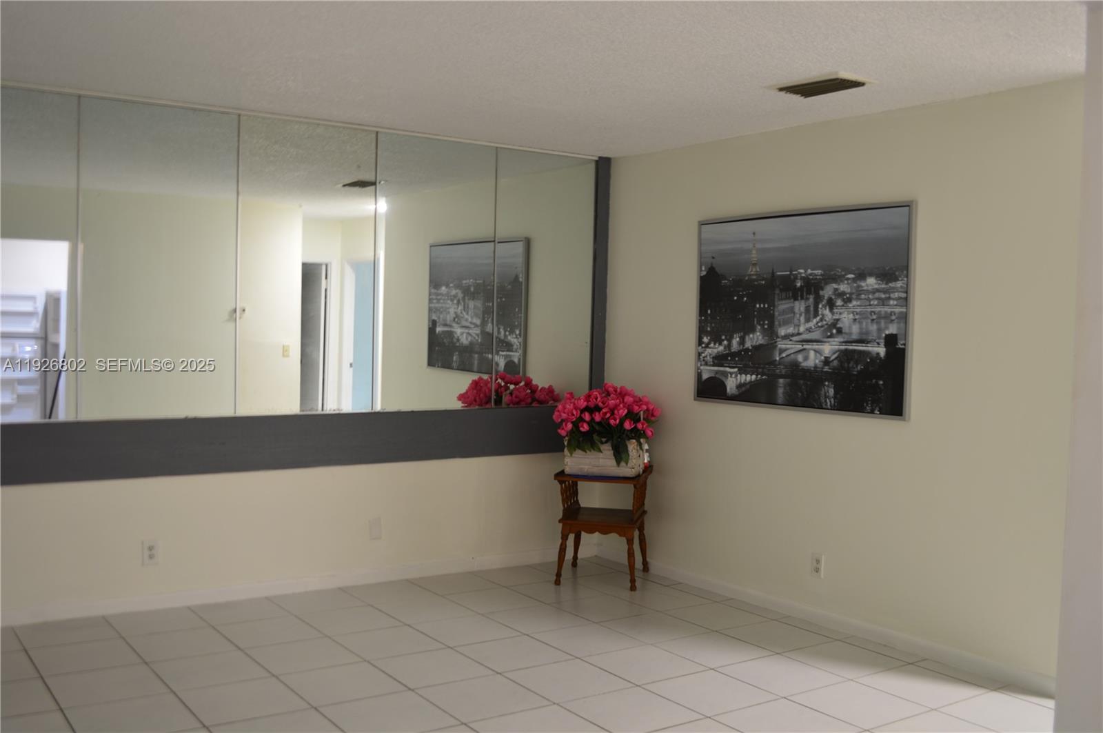 274 Southwest 9th Street, Unit 2 Dania Beach, FL 33004 - Photo 4 of 24 a living room with furniture and flowers