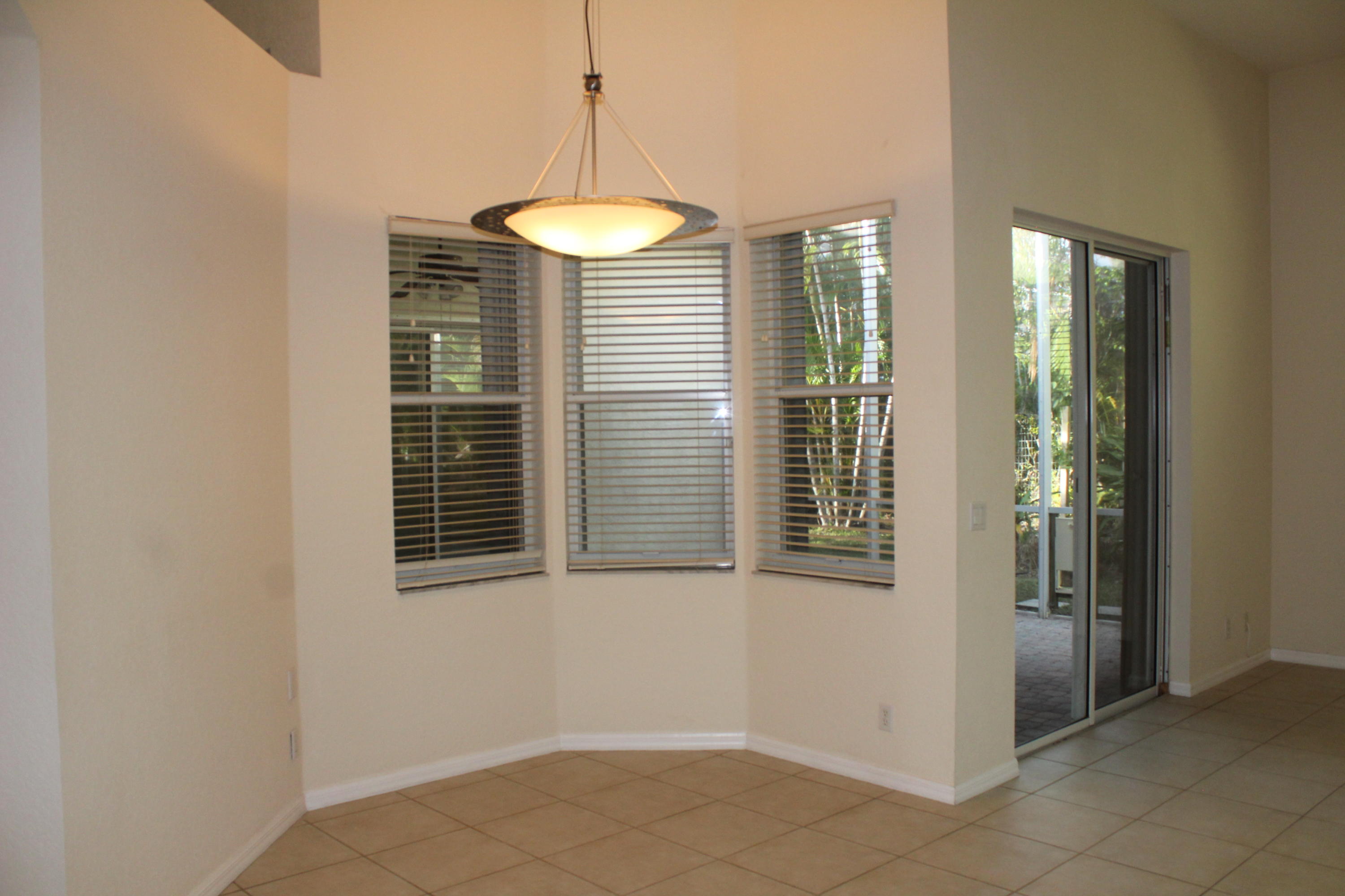 11241 Sea Grass Circle Boca Raton, FL 33498 - Photo 12 of 33 a view of an empty room with a window