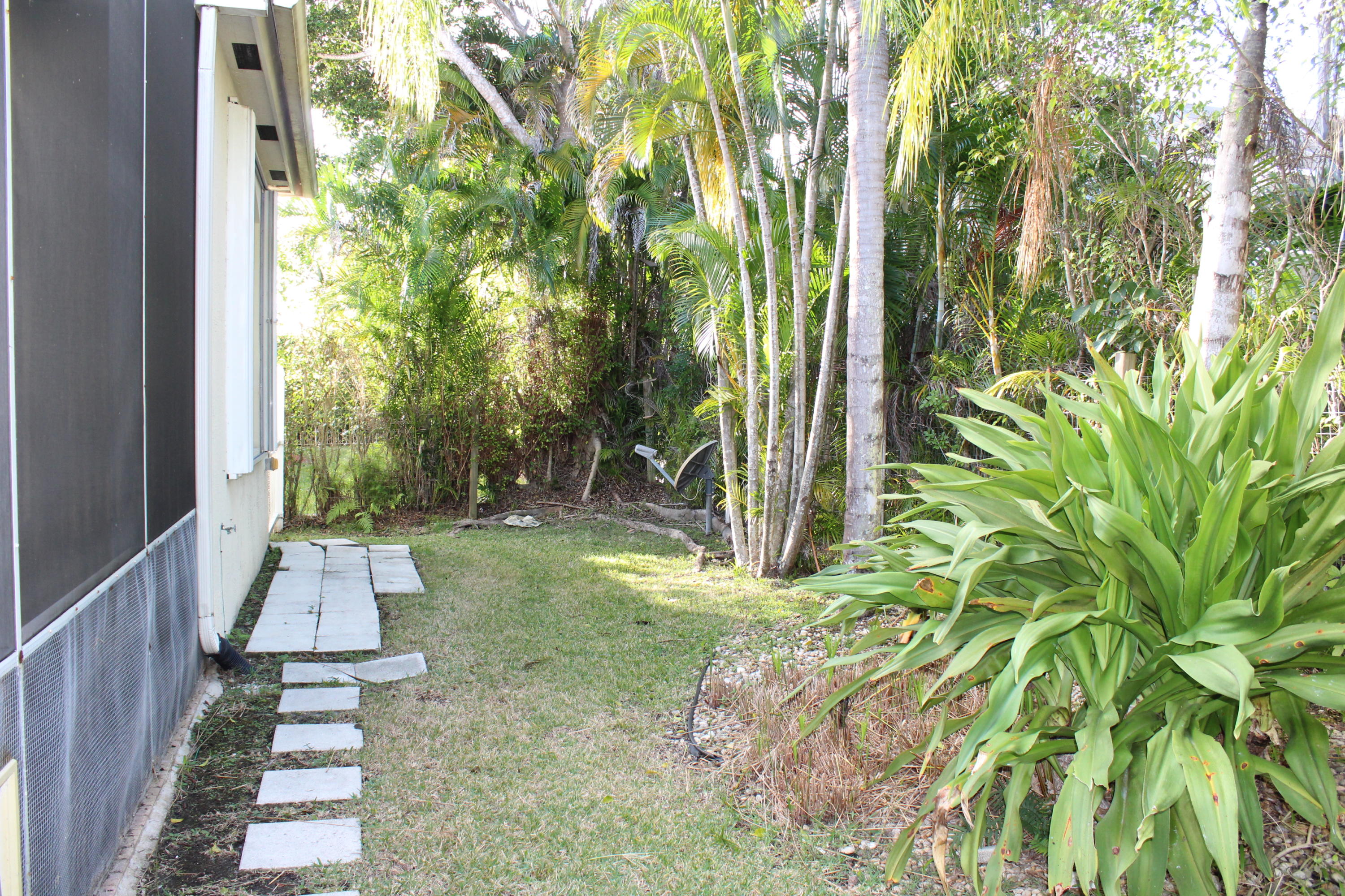 11241 Sea Grass Circle Boca Raton, FL 33498 - Photo 20 of 33 a view of backyard with plants and outdoor seating