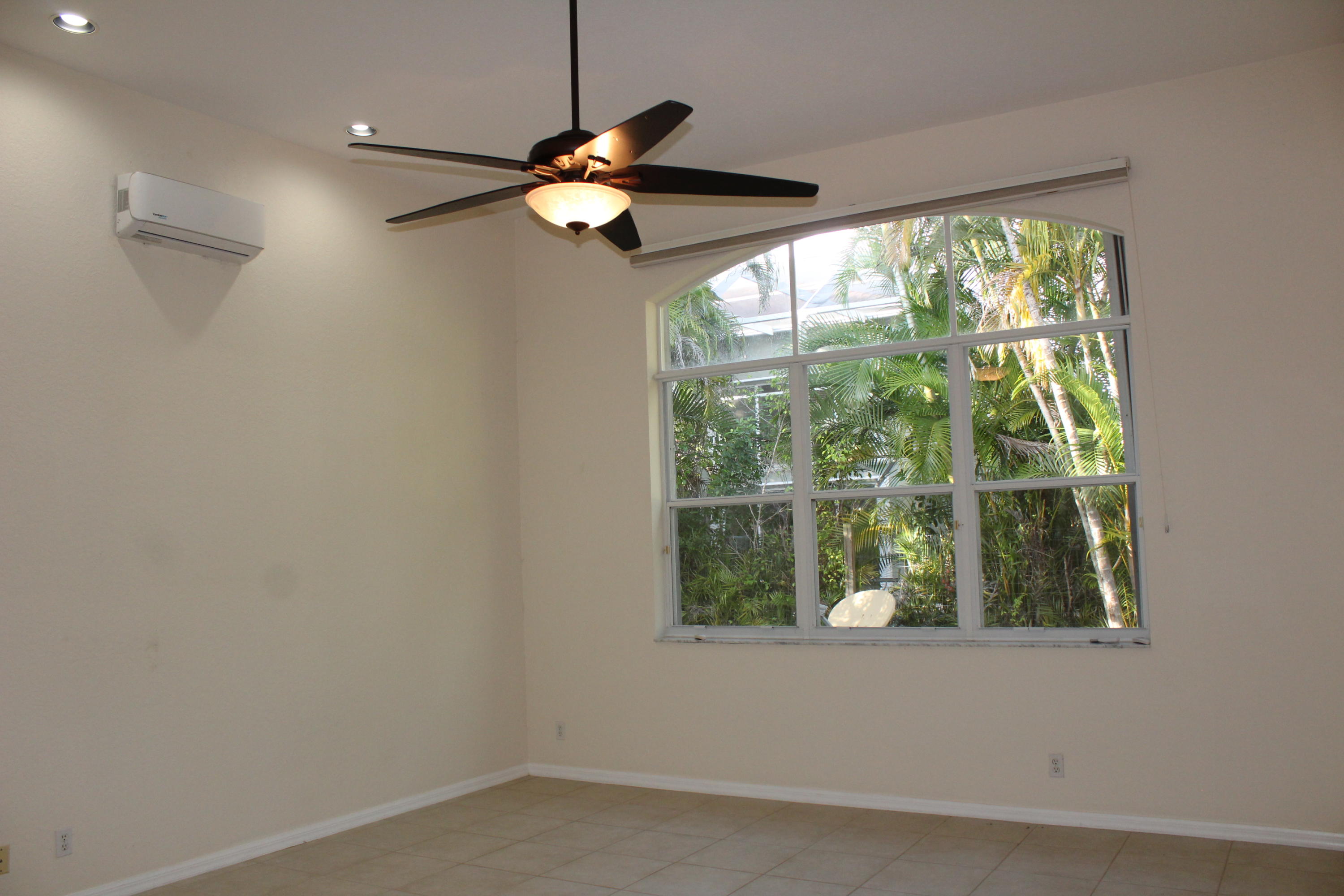 11241 Sea Grass Circle Boca Raton, FL 33498 - Photo 22 of 33 an empty room with windows and outdoor view