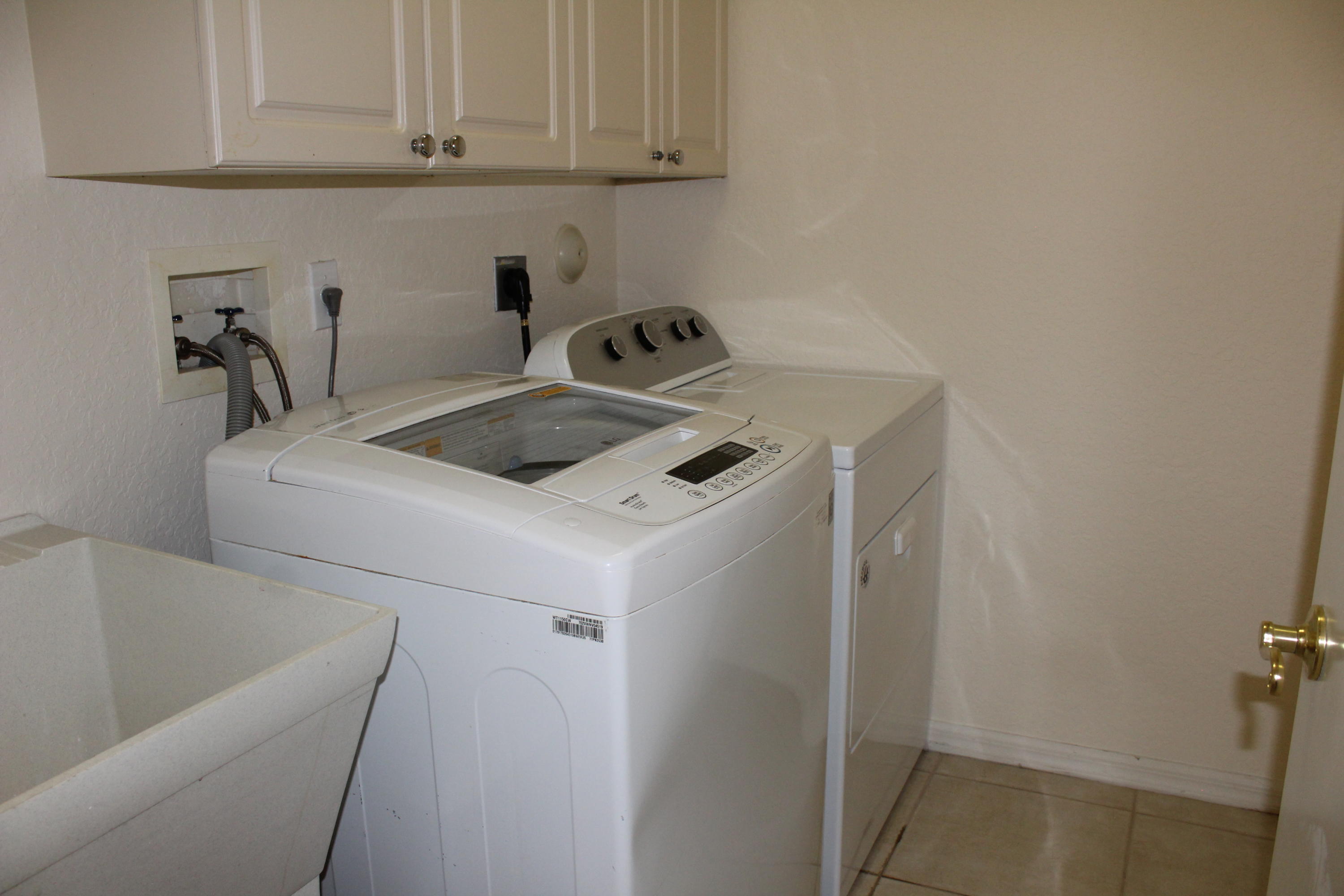 11241 Sea Grass Circle Boca Raton, FL 33498 - Photo 25 of 33 a utility room with dryer and washer