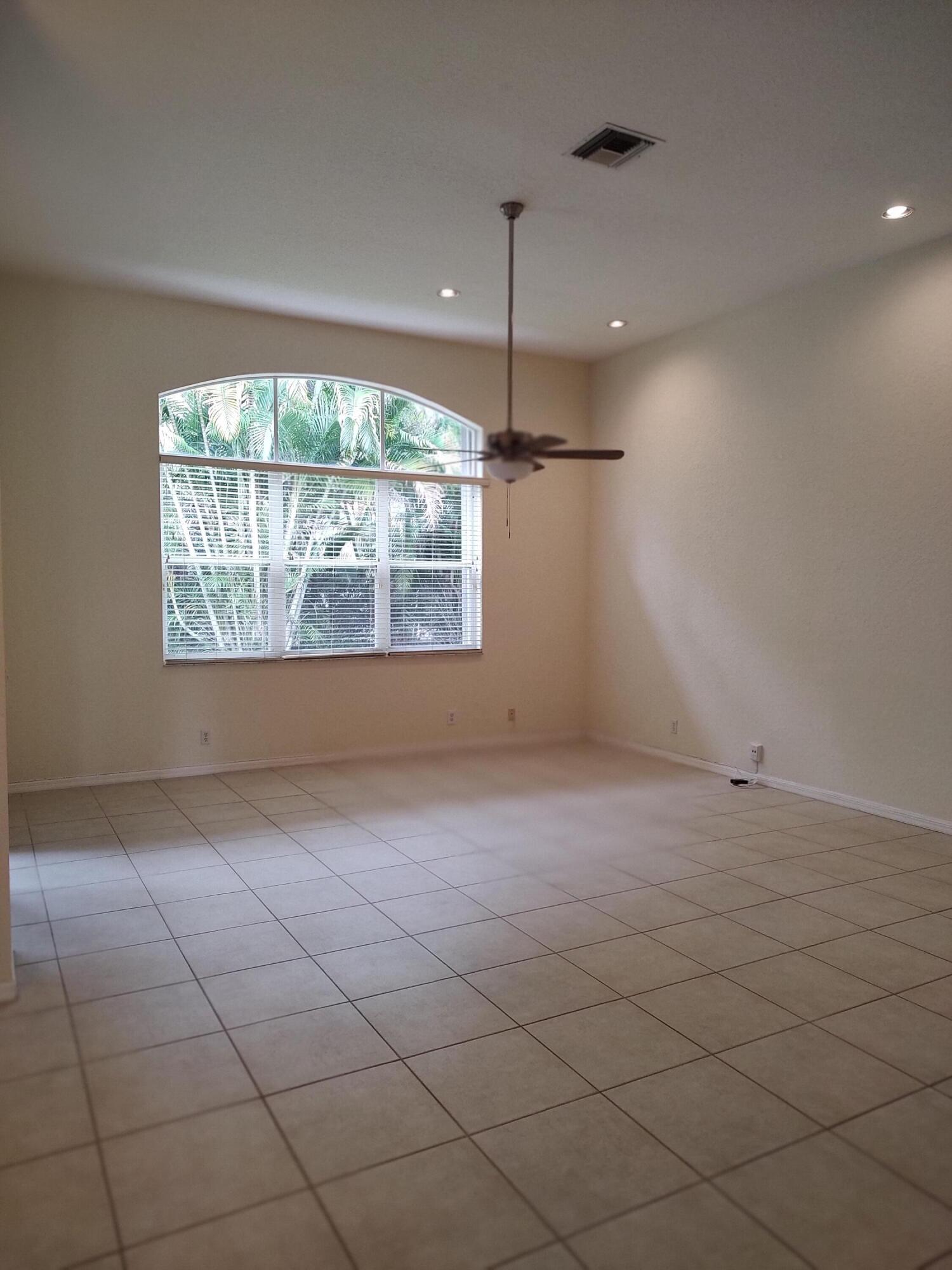 11241 Sea Grass Circle Boca Raton, FL 33498 - Photo 9 of 33 an empty room with a empty space and windows