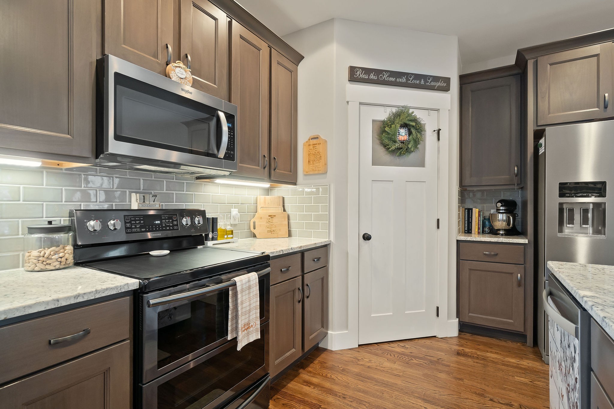 1138 Old Sparta Road Cookeville, TN 38506 - Photo 8 of 39 a kitchen with stainless steel appliances a stove a microwave and cabinets