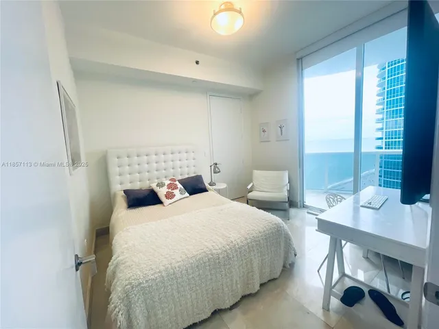 a bathroom with a granite countertop sink toilet a mirror and shower