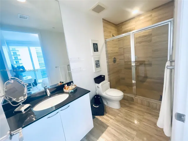 a view of hallway with bathroom