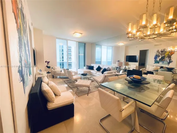 a view of a living room and dining room
