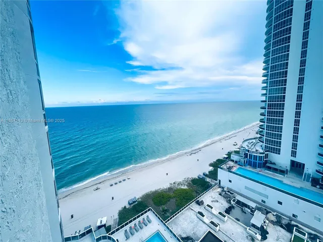 a view of a balcony with ocean view