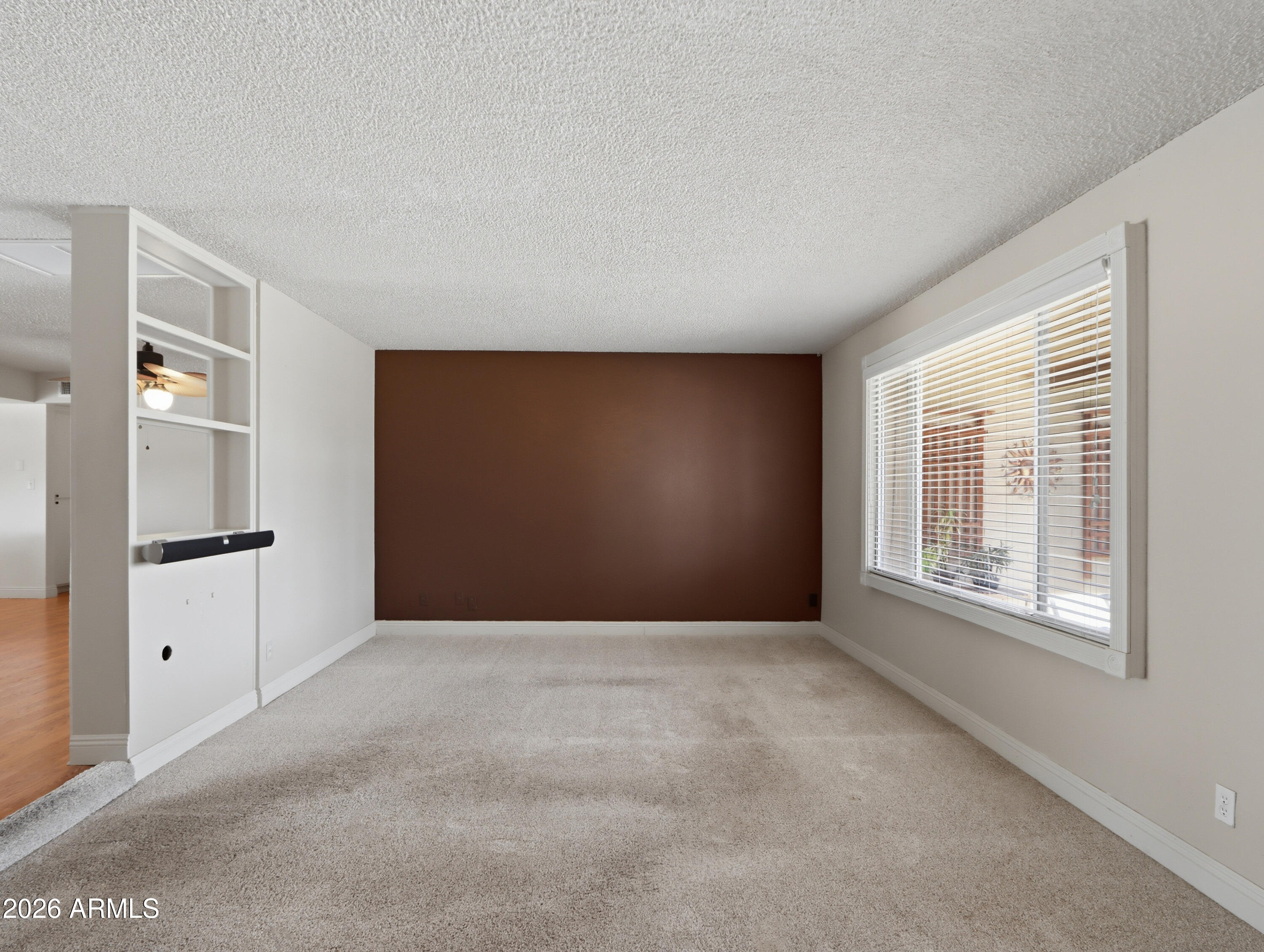 450 Cascada Road Litchfield Park, AZ 85340 - Photo 8 of 40 a view of an empty room with a window