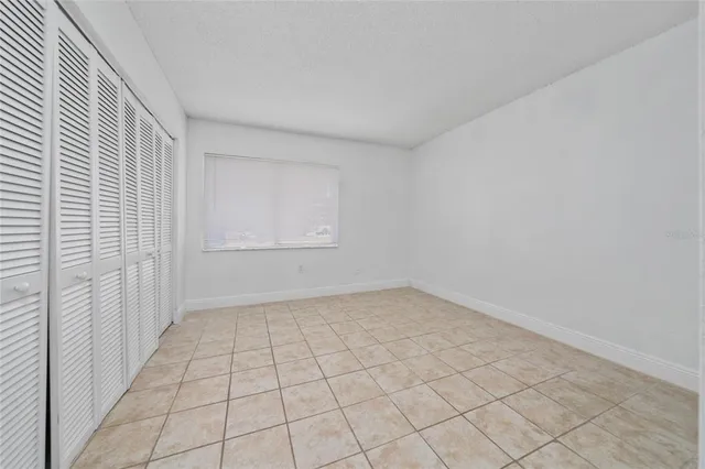 an empty room with white walls