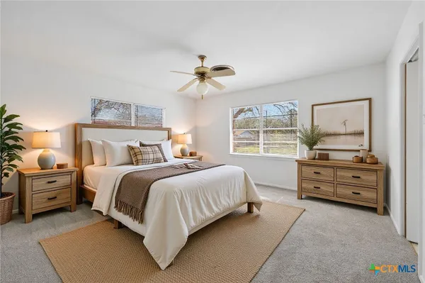 a bedroom with a bed and a dresser