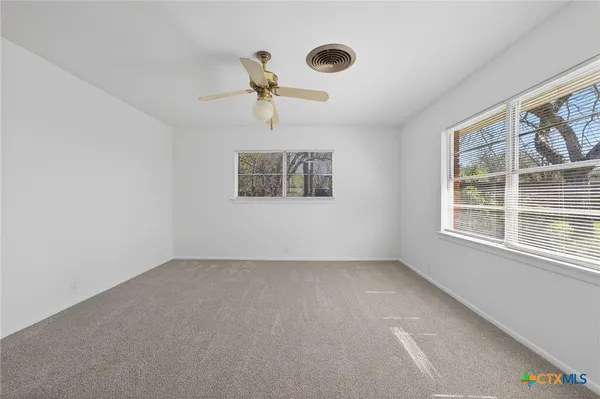 an empty room with windows