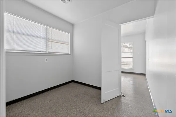 an empty room with windows