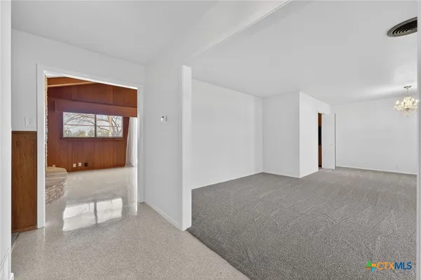 a view of an empty room and window