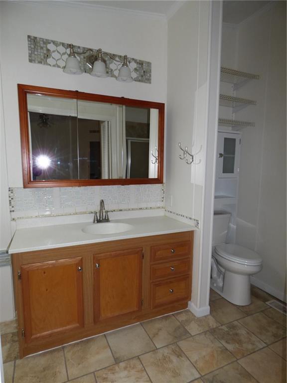 383 Eagle Lane Apollo, PA 15613 - Photo 12 of 25 a bathroom with a toilet sink and mirror