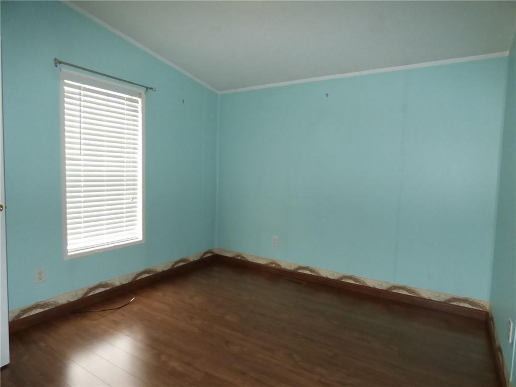 383 Eagle Lane Apollo, PA 15613 - Photo 15 of 25 an empty room with wooden floor and windows