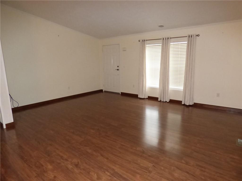 383 Eagle Lane Apollo, PA 15613 - Photo 2 of 25 a view of an empty room with wooden floor and a window