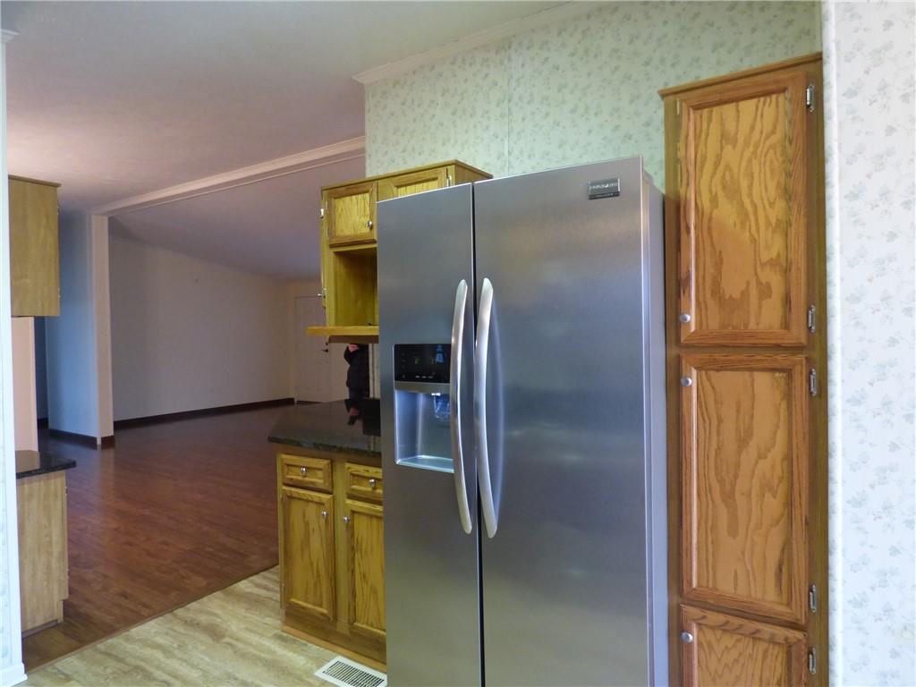 383 Eagle Lane Apollo, PA 15613 - Photo 5 of 25 a metallic refrigerator freezer sitting in a kitchen
