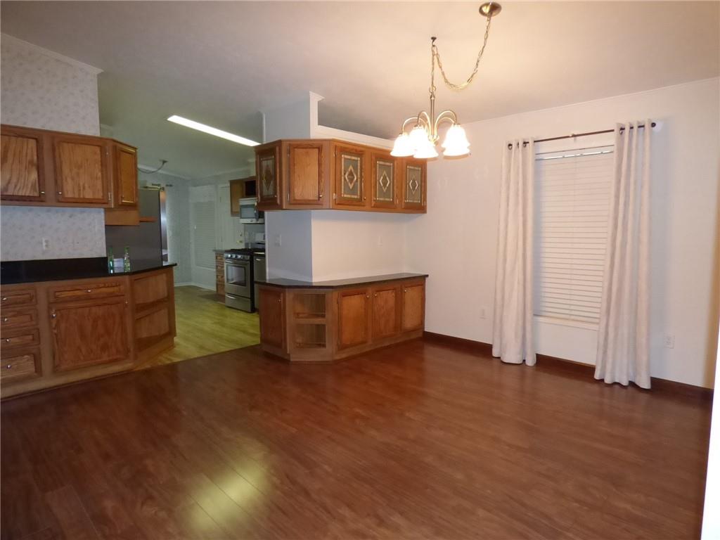 383 Eagle Lane Apollo, PA 15613 - Photo 8 of 25 a view of a kitchen with wooden floor and electronic appliances
