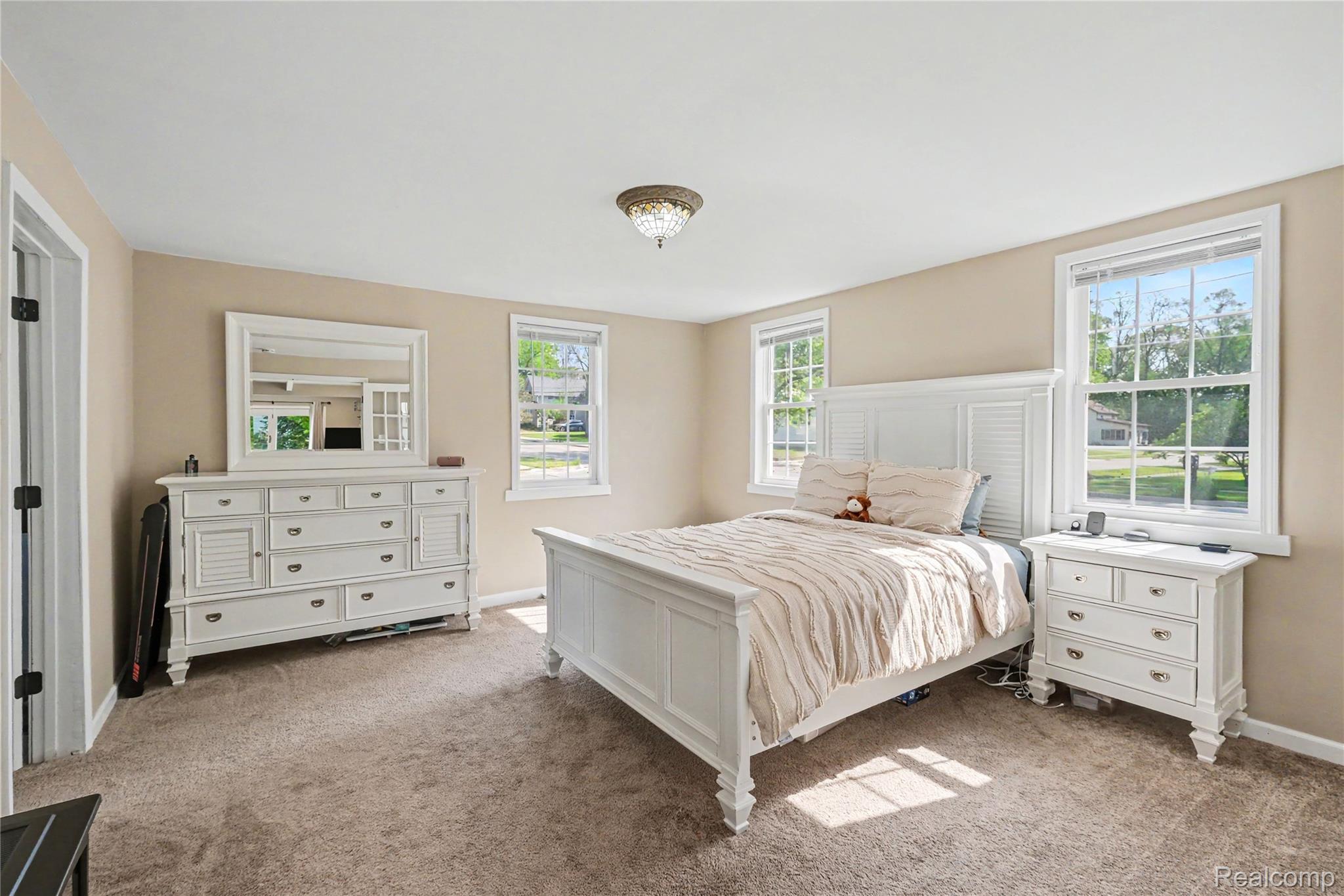 306 Mill Street Pinckney, MI 48169 - Photo 11 of 29 Large first floor primary bedroom