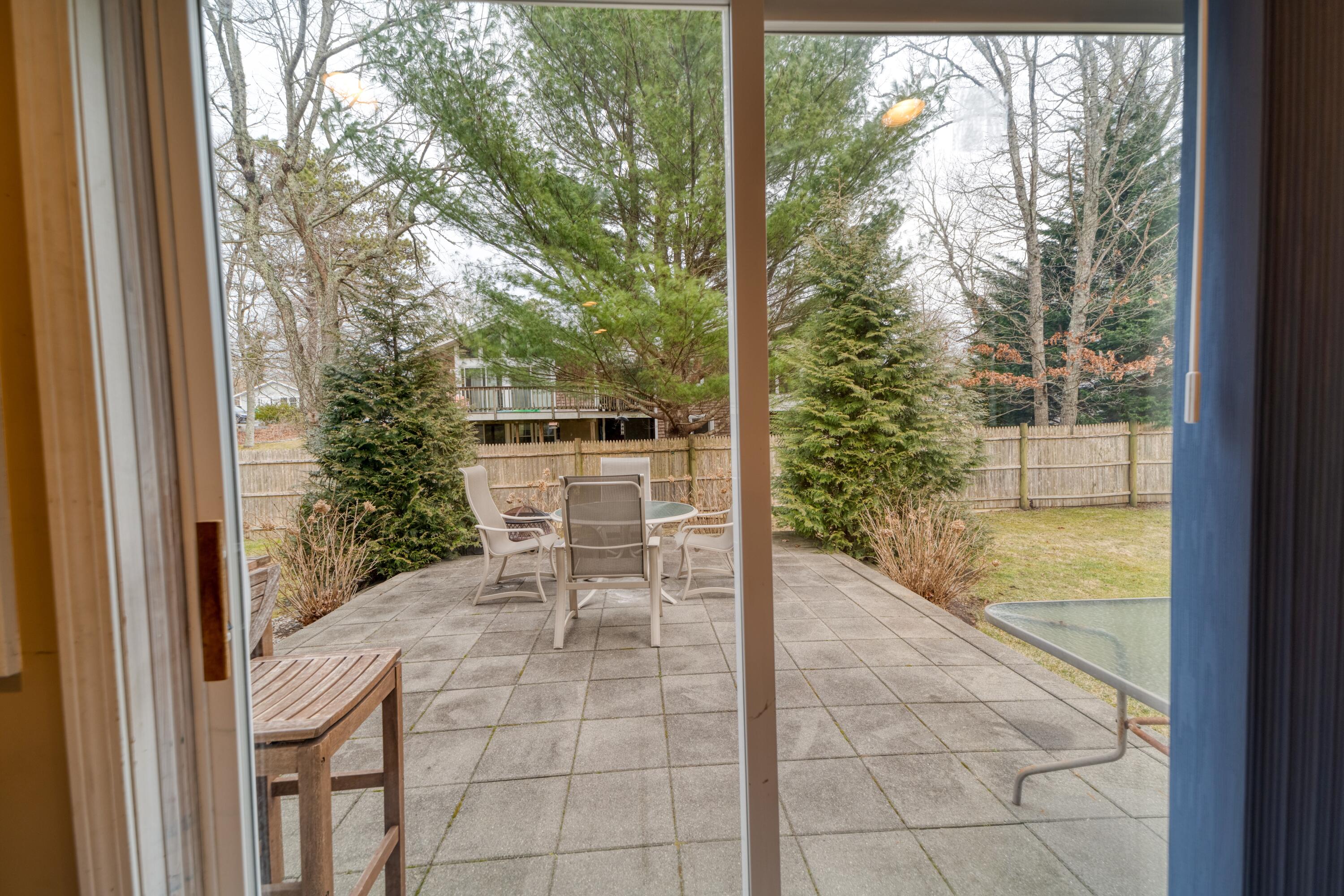 331 Cotuit Road Mashpee, MA 02649 - Photo 14 of 22 a view of a chairs and table in the balcony