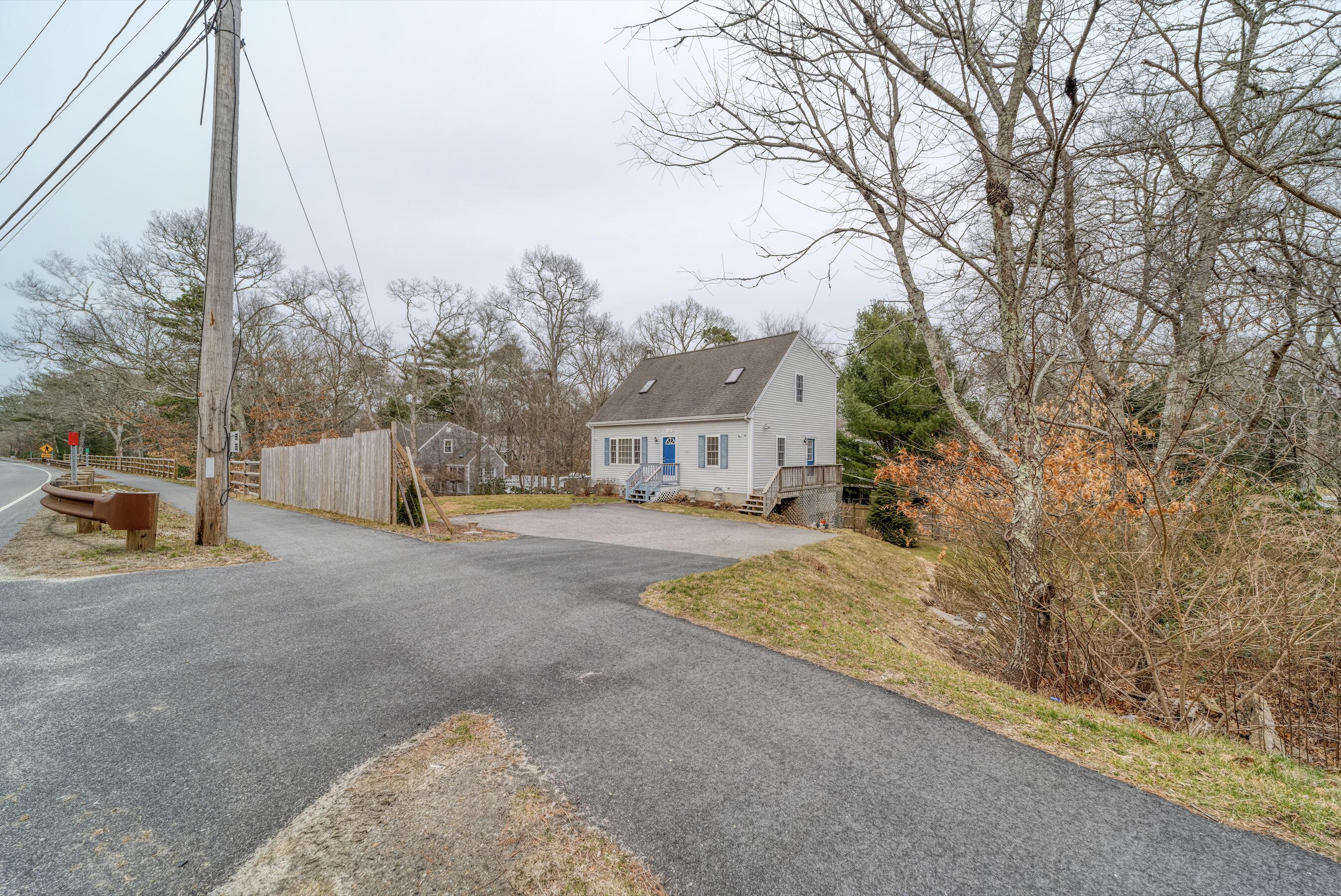 331 Cotuit Road Mashpee, MA 02649 - Photo 18 of 22 a view of street with parked cars