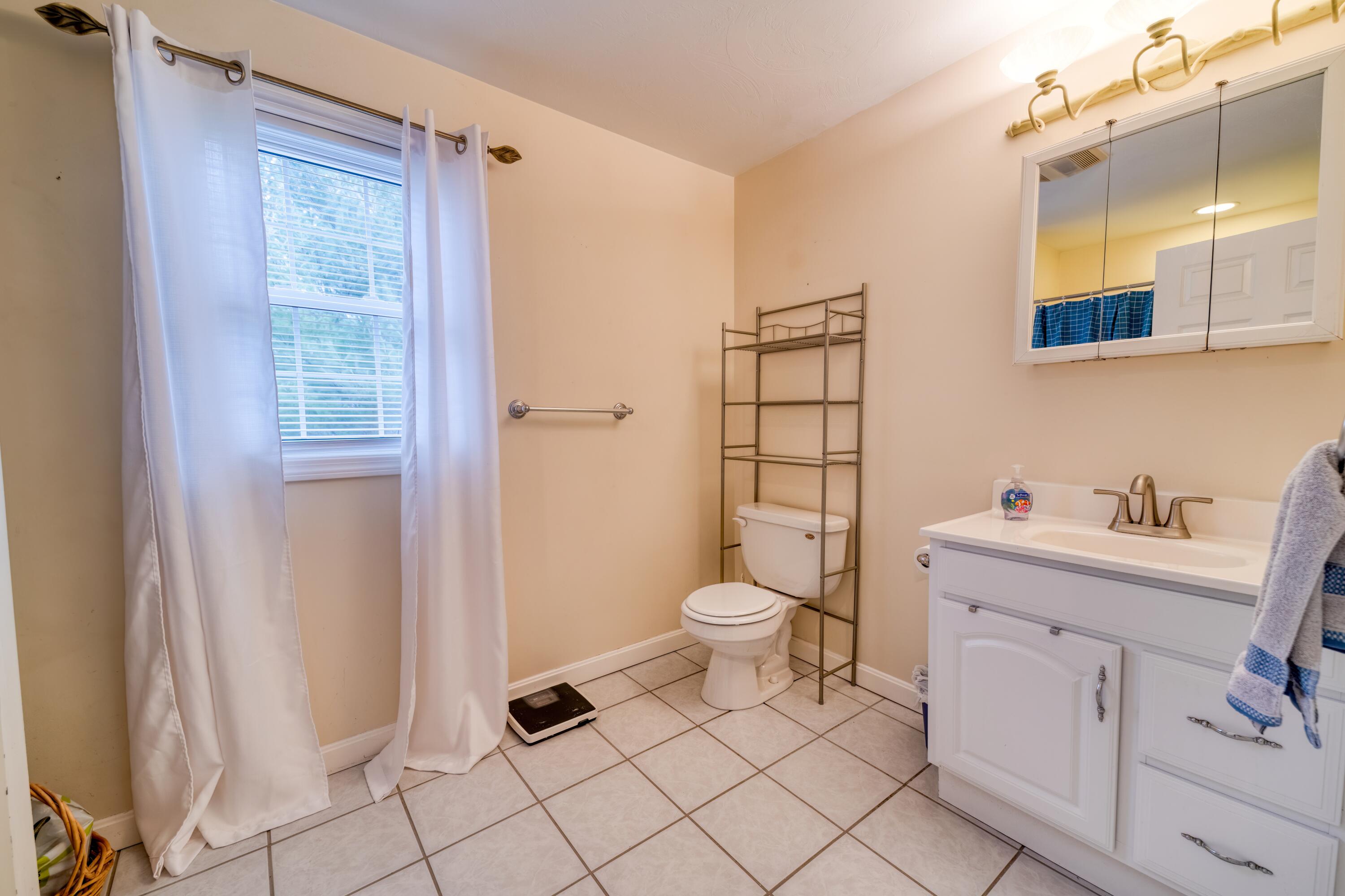 331 Cotuit Road Mashpee, MA 02649 - Photo 8 of 22 a bathroom with a toilet sink and a shower