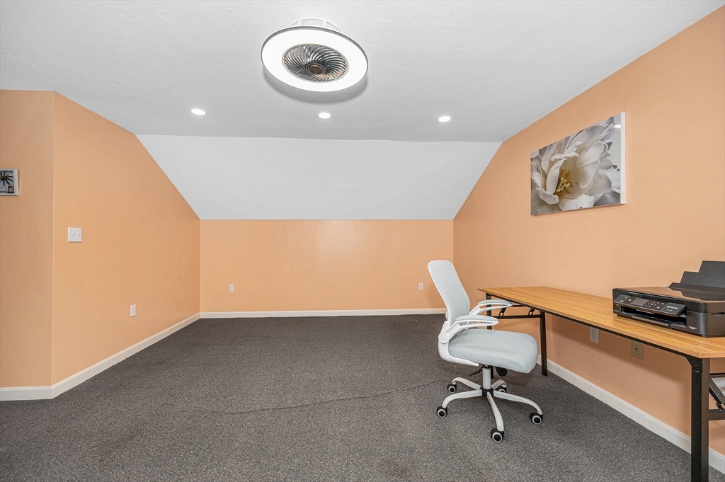 20 Chandler Drive, Unit 20 Atkinson, NH 03811 - Photo 19 of 33 a chair and a table in a room