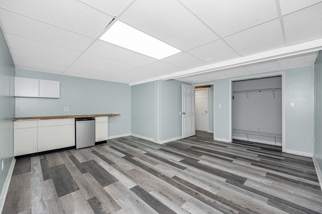 20 Chandler Drive, Unit 20 Atkinson, NH 03811 - Photo 28 of 33 a view of an empty room with wooden floor and closet