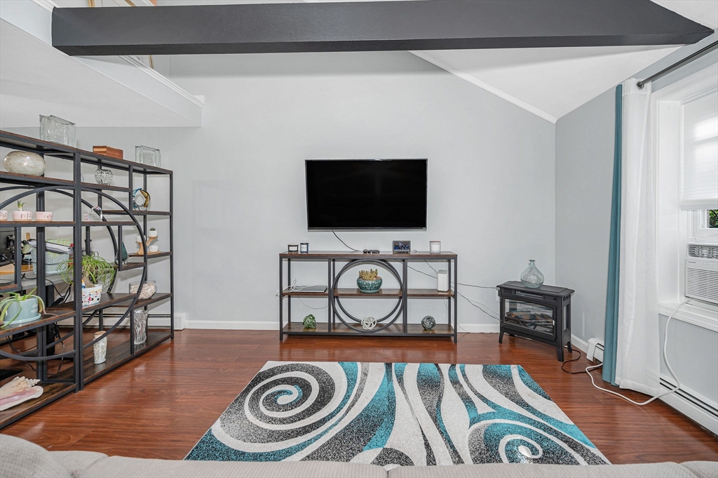 20 Chandler Drive, Unit 20 Atkinson, NH 03811 - Photo 8 of 33 a view of a livingroom with furniture and a flat screen tv